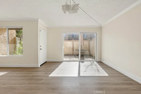 an entryway with wooden floor