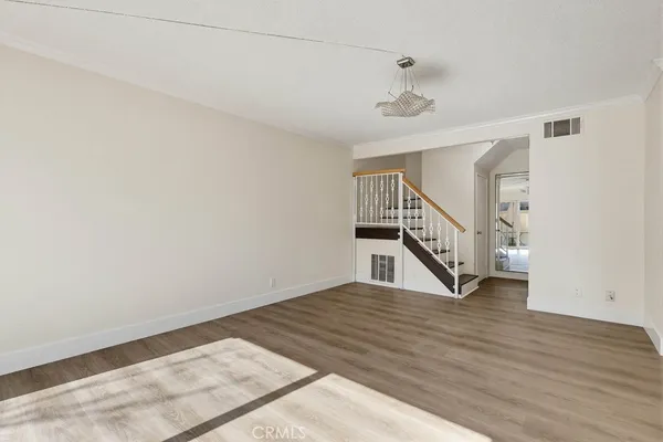 a view of an entryway with wooden floor