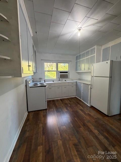1711 Dickinson Road Hickory, NC 28602 - Photo 12 of 13 a kitchen with wooden floors and white walls