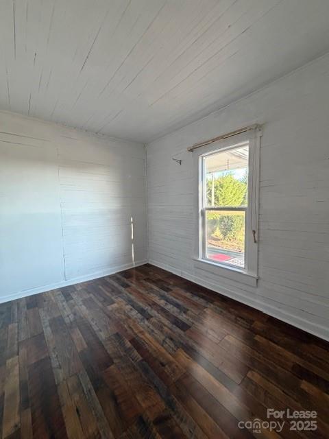 1711 Dickinson Road Hickory, NC 28602 - Photo 5 of 13 an empty room with wooden floor and windows