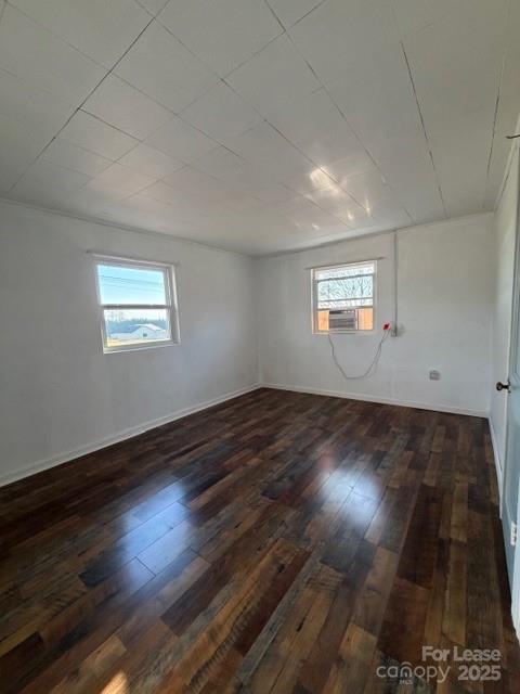 1711 Dickinson Road Hickory, NC 28602 - Photo 6 of 13 an empty room with wooden floor and windows