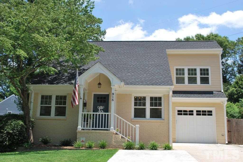 918 Dixie Trail Raleigh, NC 27607 - Photo 1 of 23 a front view of a house with a yard
