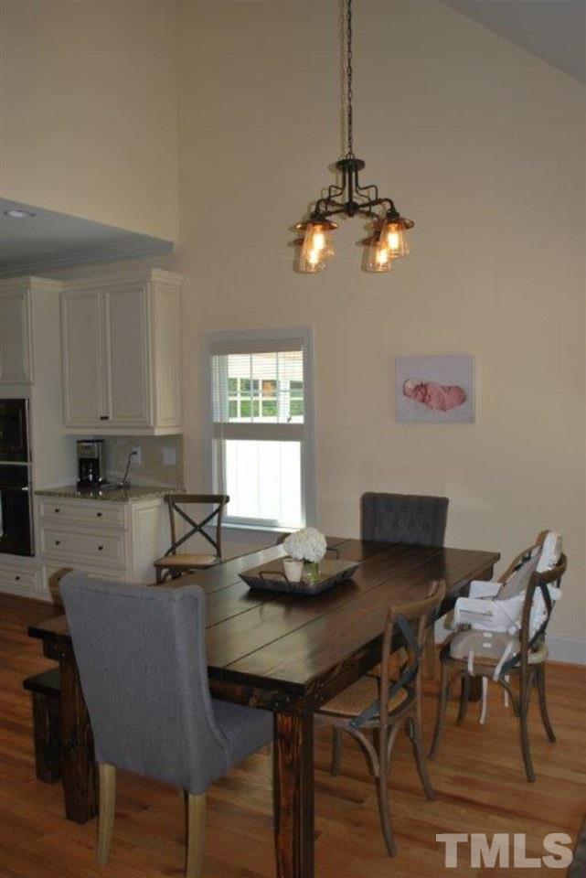 918 Dixie Trail Raleigh, NC 27607 - Photo 11 of 23 a view of a dining room with furniture window and wooden floor