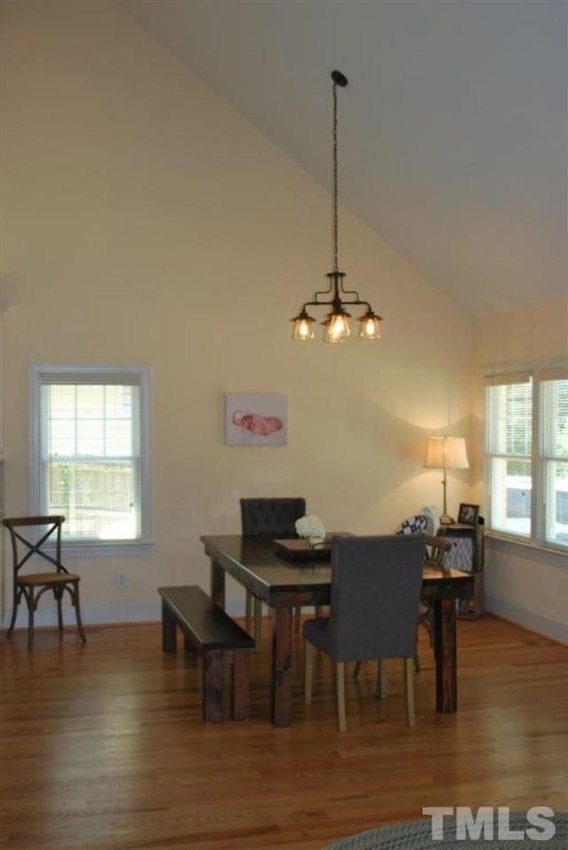 918 Dixie Trail Raleigh, NC 27607 - Photo 12 of 23 a view of a dining room with furniture window and wooden floor