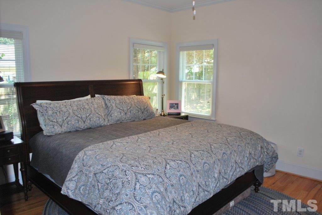 918 Dixie Trail Raleigh, NC 27607 - Photo 15 of 23 a bedroom with a bed and window