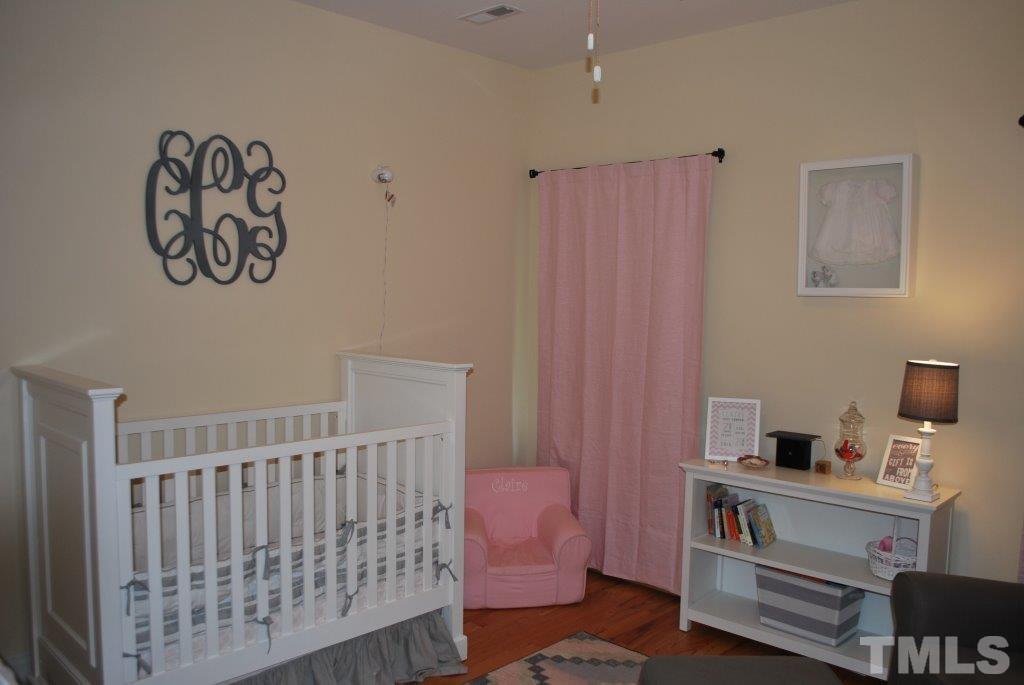 918 Dixie Trail Raleigh, NC 27607 - Photo 18 of 23 a bedroom with a bed and a window