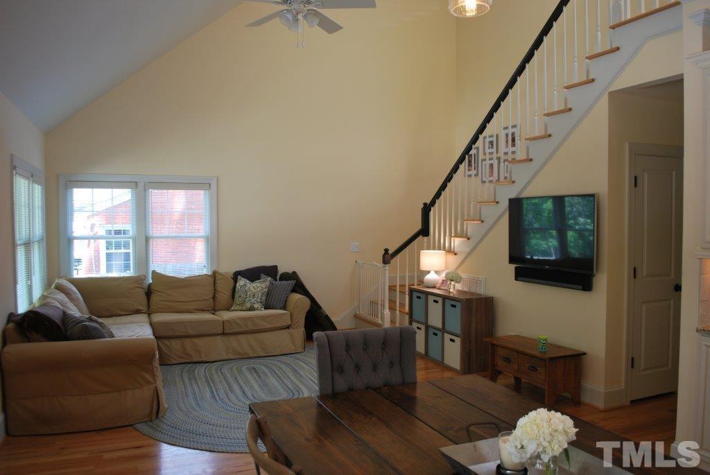 918 Dixie Trail Raleigh, NC 27607 - Photo 3 of 23 a living room with furniture or stairs and a couch
