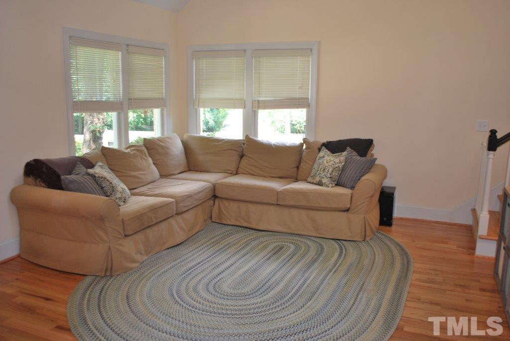 918 Dixie Trail Raleigh, NC 27607 - Photo 5 of 23 a living room with furniture and a large window