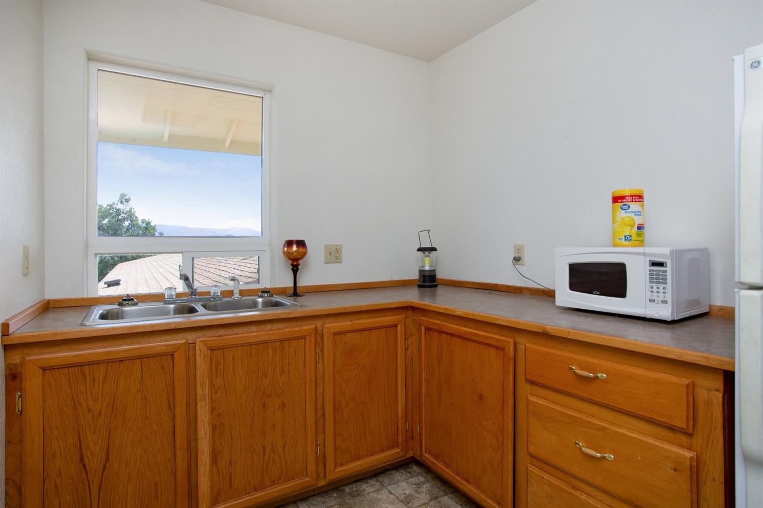 940 Ayres Road Eagle Point, OR 97524 - Photo 21 of 35 a kitchen with sink and cabinets