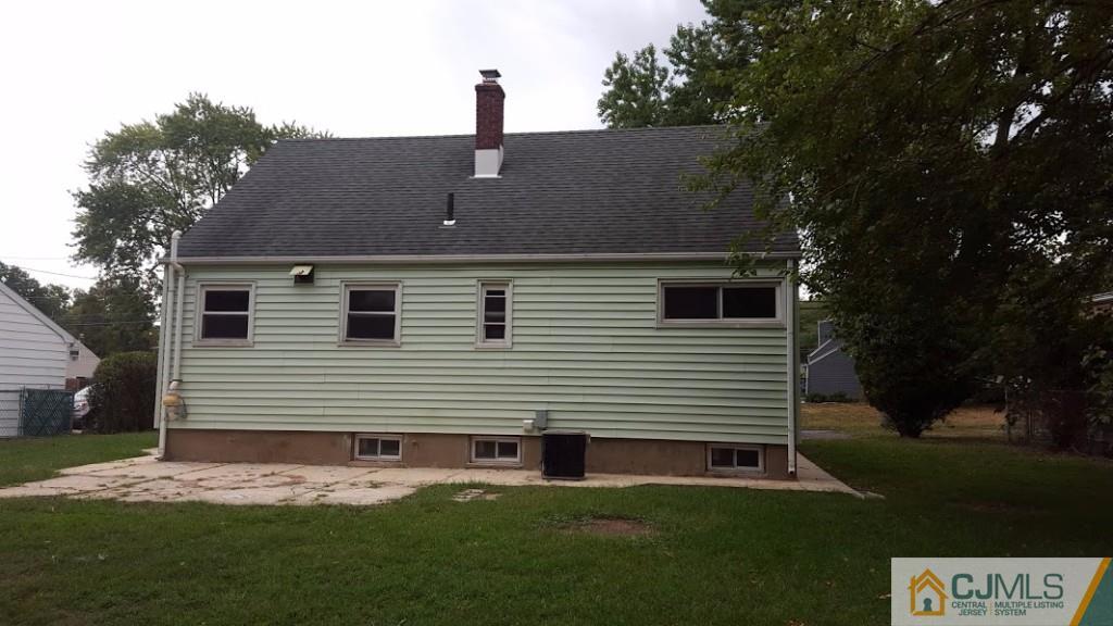 4 Wilcox Road New Brunswick, NJ 08901 - Photo 2 of 14 a front view of a house with a garden