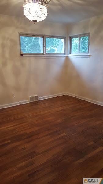 4 Wilcox Road New Brunswick, NJ 08901 - Photo 7 of 14 an empty room with wooden floor