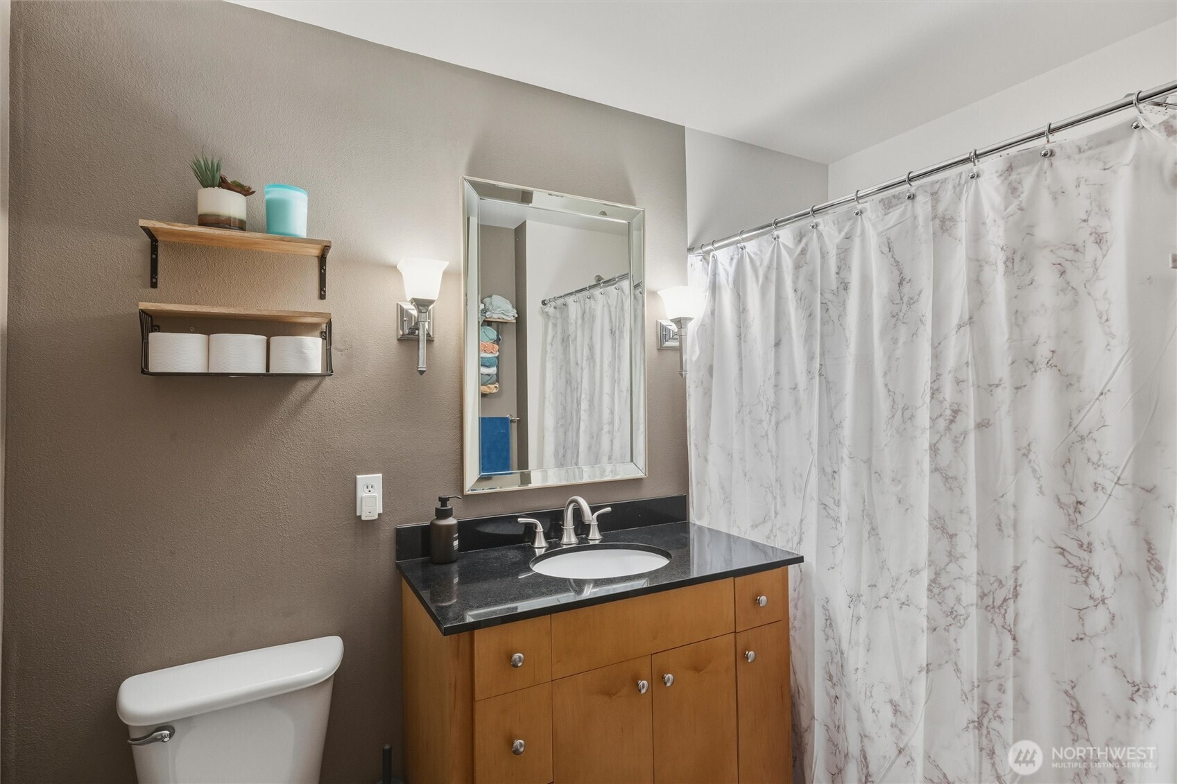 255 West Bakerview Road, Unit B103 Bellingham, WA 98226 - Photo 18 of 40 a bathroom with a granite countertop sink a toilet and a mirror