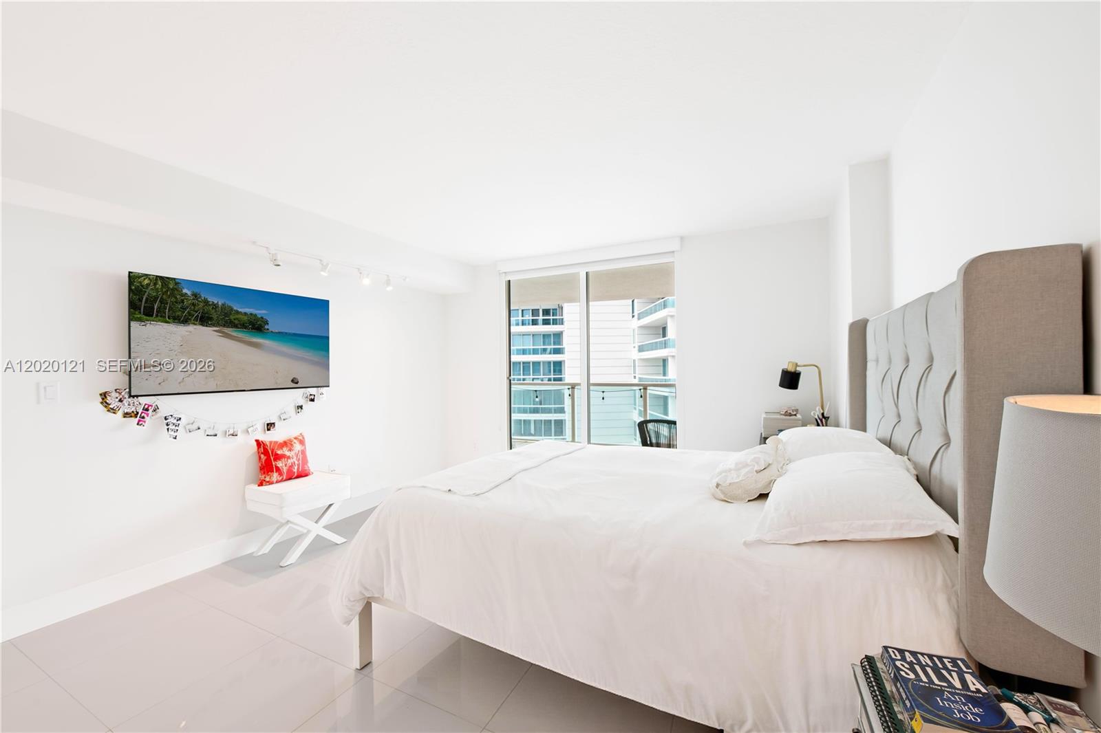2101 Brickell Avenue, Unit 1909 Miami, FL 33129 - Photo 13 of 25 a bedroom with a bed and a flat screen tv