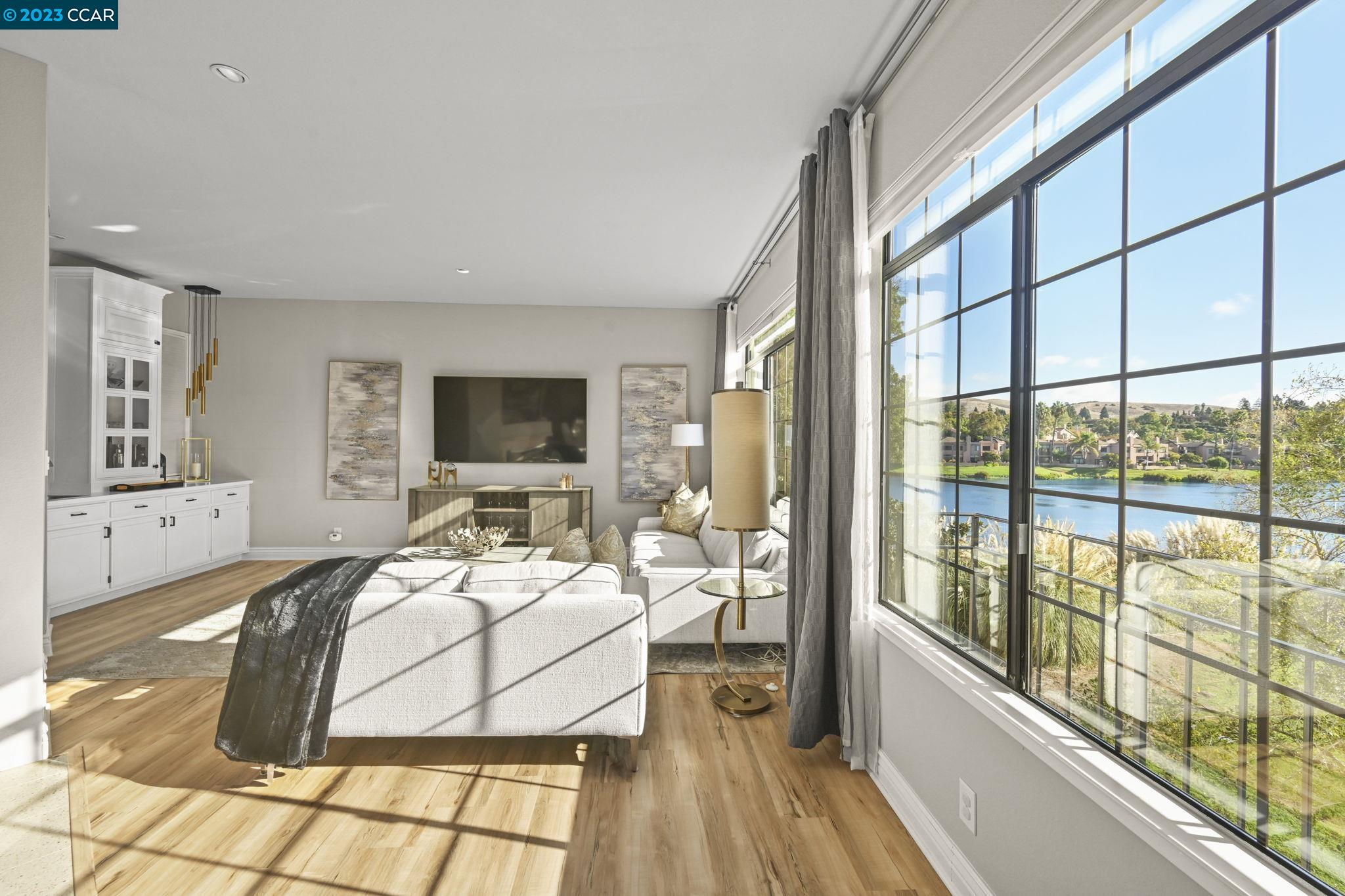 30 Eagle Lake Place, Unit 23 San Ramon, CA 94582 - Photo 1 of 1 a living room with furniture and a flat screen tv