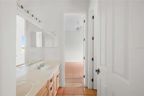 a view of a kitchen with a sink and a window