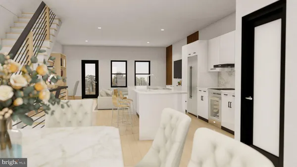 a view of kitchen with furniture and refrigerator