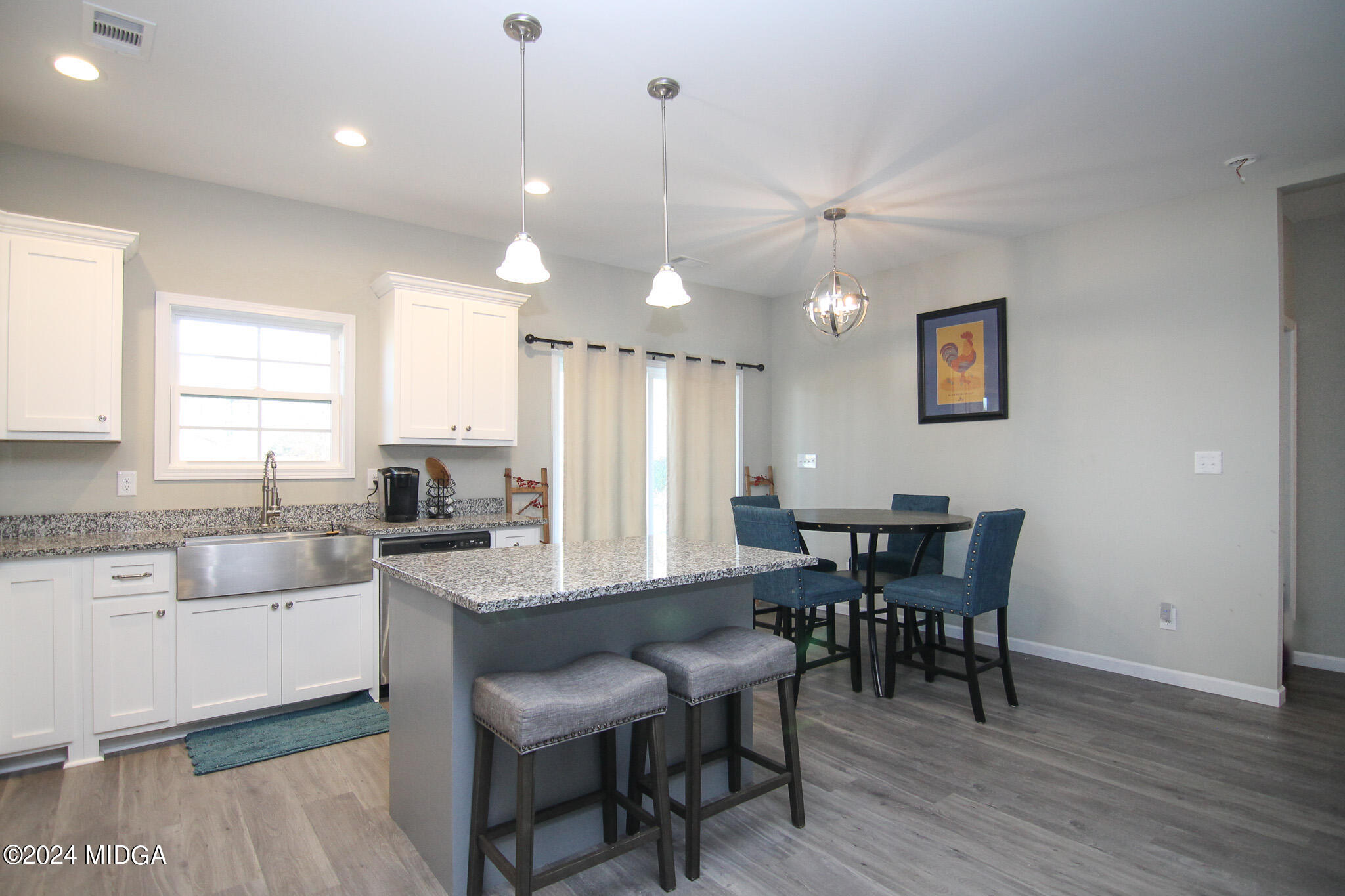 144 Summit Drive Byron, GA 31008 - Photo 12 of 27 a large kitchen with a table and chairs