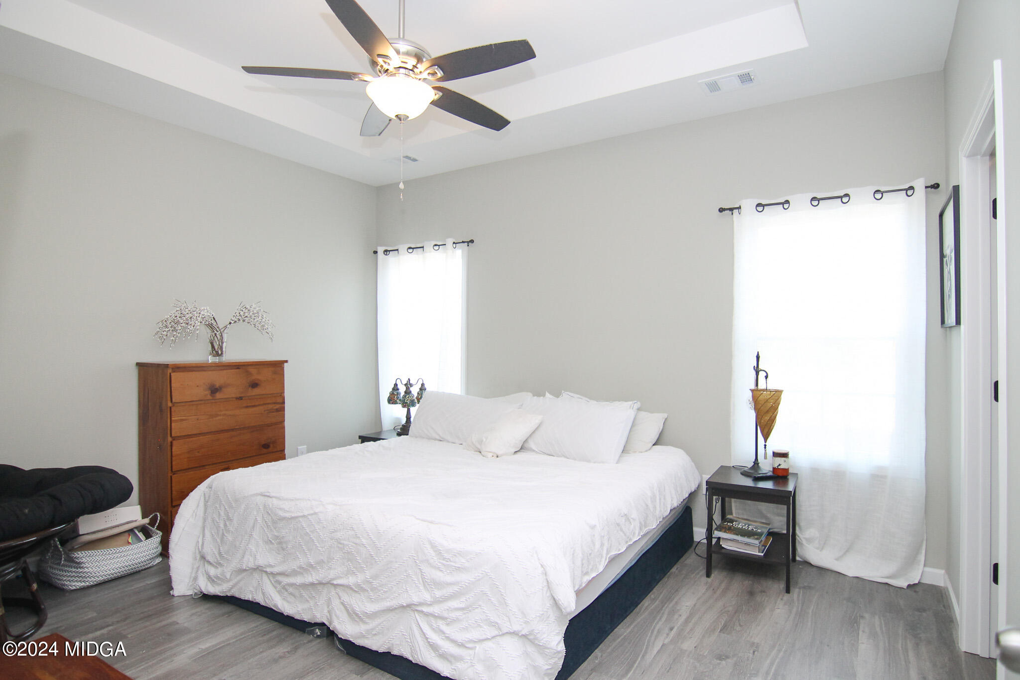 144 Summit Drive Byron, GA 31008 - Photo 14 of 27 a bedroom with a bed and a chandelier