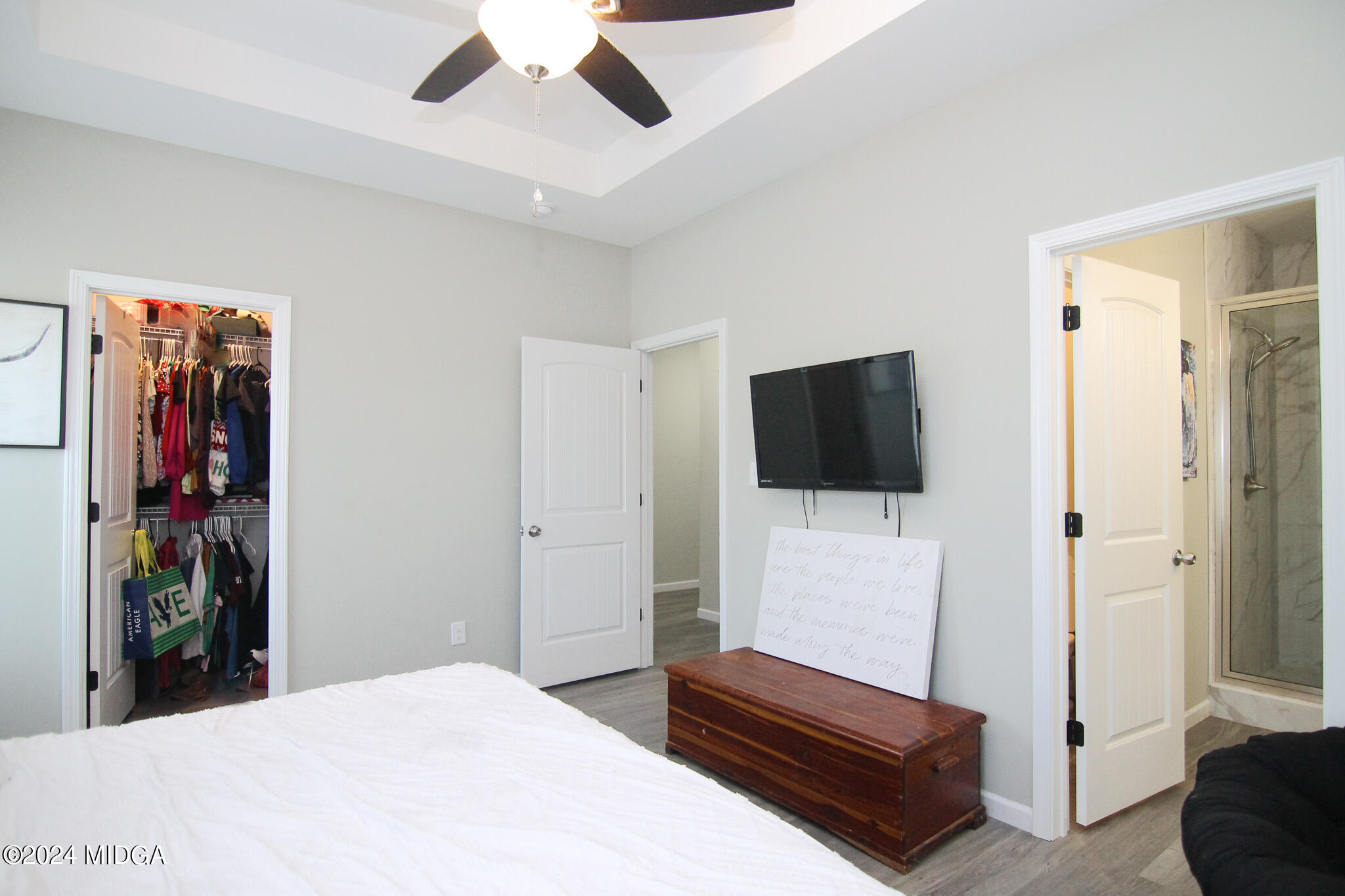 144 Summit Drive Byron, GA 31008 - Photo 16 of 27 a bedroom with a bed and a flat screen tv