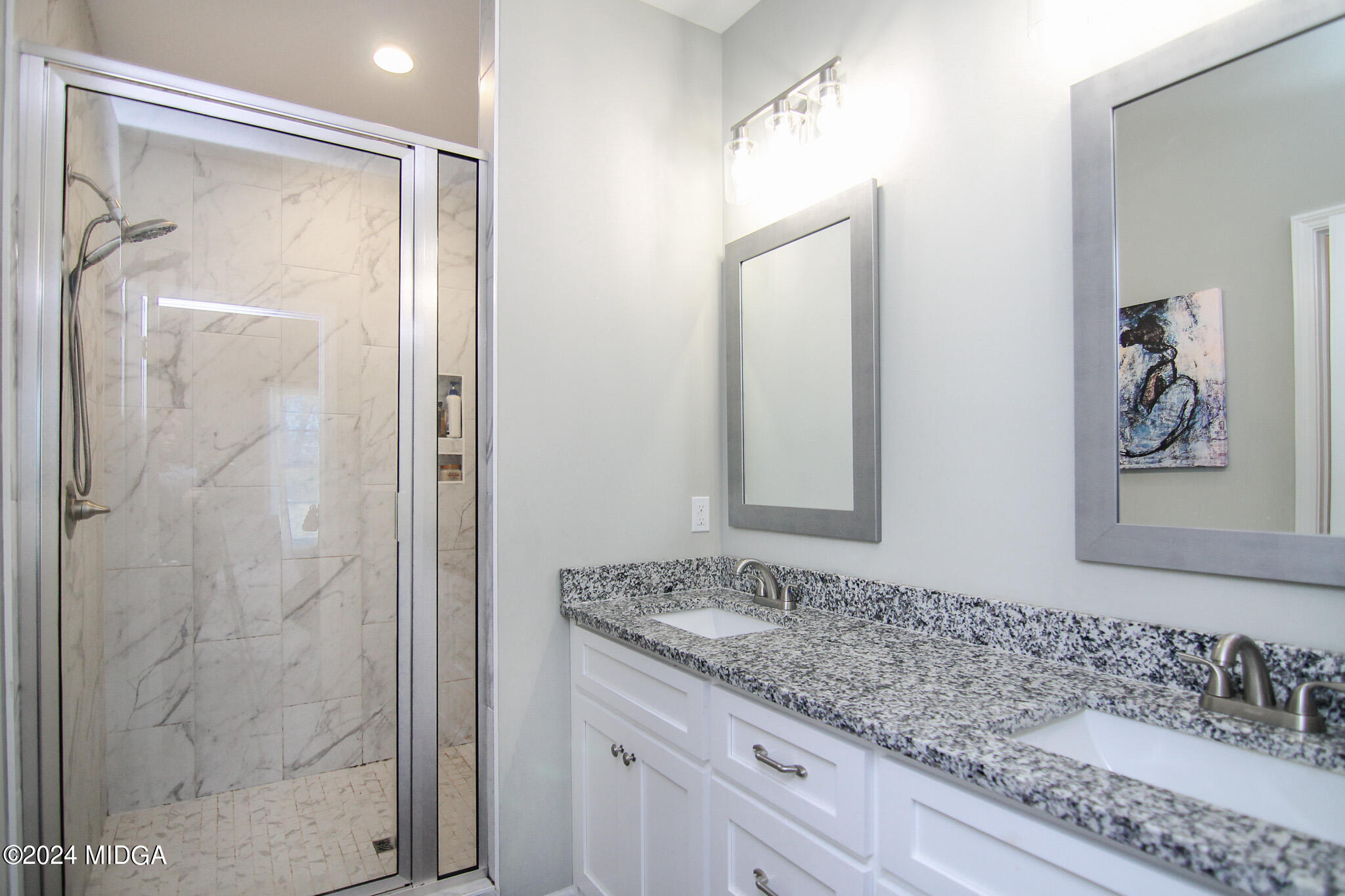 144 Summit Drive Byron, GA 31008 - Photo 17 of 27 a bathroom with a granite countertop sink a mirror and a shower