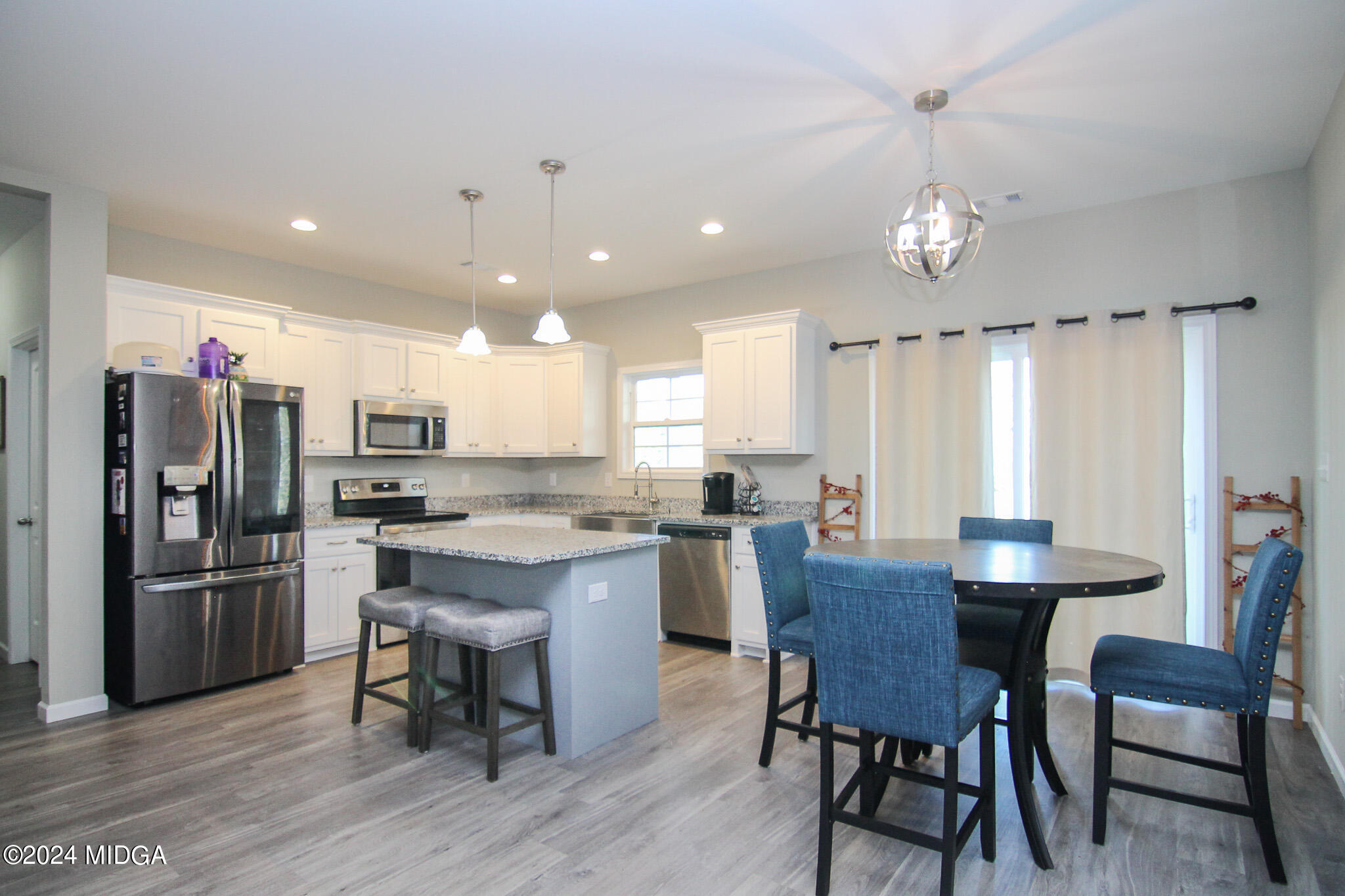 144 Summit Drive Byron, GA 31008 - Photo 9 of 27 a view of a dining room with furniture window and wooden floor