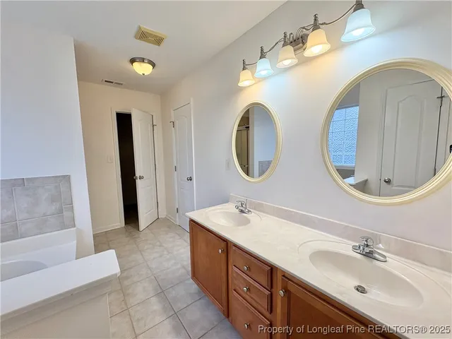 a white bath tub sitting next to a window