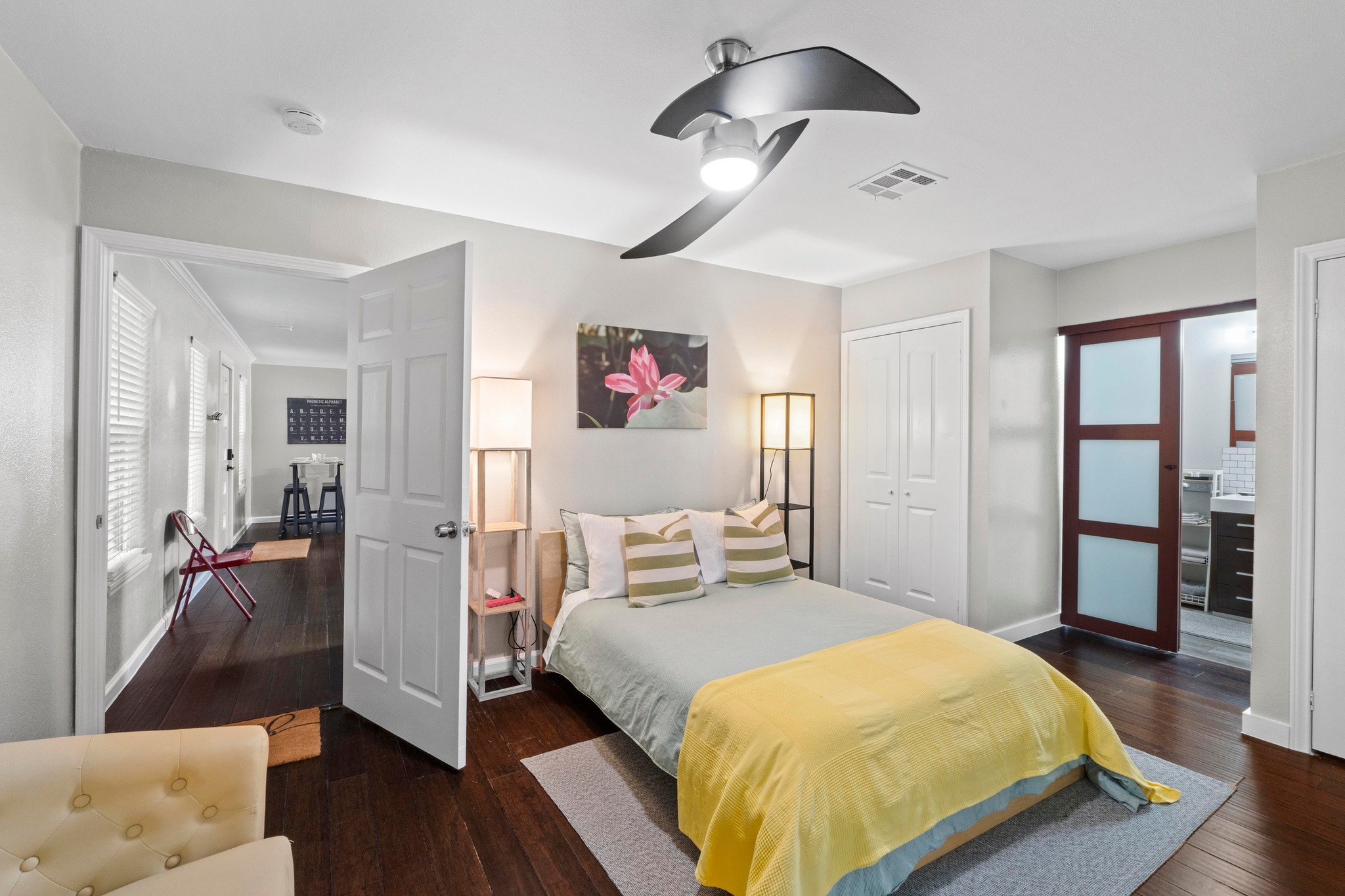 4512 Speedway, Unit A Austin, TX 78751 - Photo 22 of 39 a bedroom with a bed and wooden floor