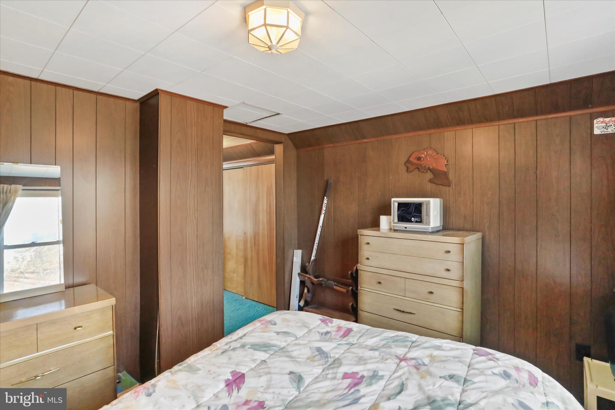 14111 Green Ridge Road Northeast Flintstone, MD 21530 - Photo 19 of 24 a bedroom with a bed and a window