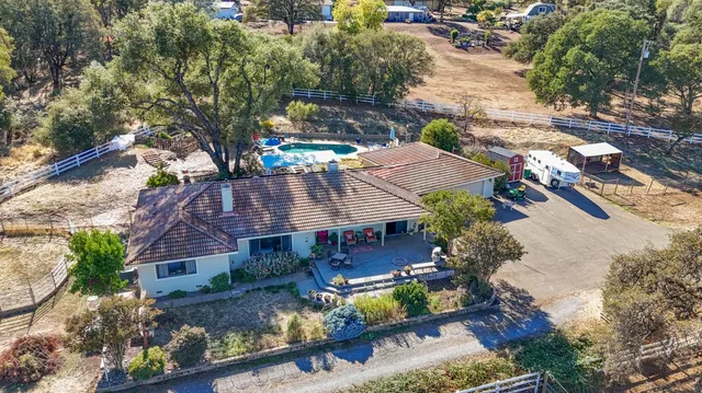 a front view of a house with outdoor seating