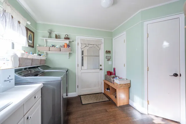 a bathroom with a sink vanity mirror and toilet