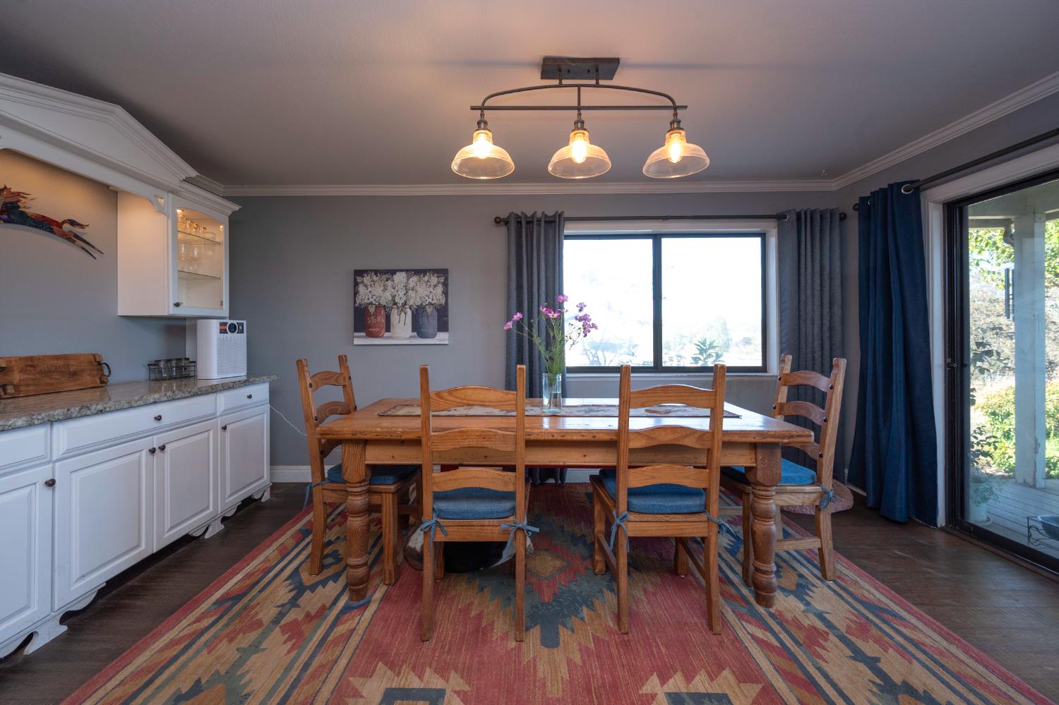 4770 Pedro Hill Road Pilot Hill, CA 95664 - Photo 51 of 87 a view of a dining room with furniture window and wooden floor