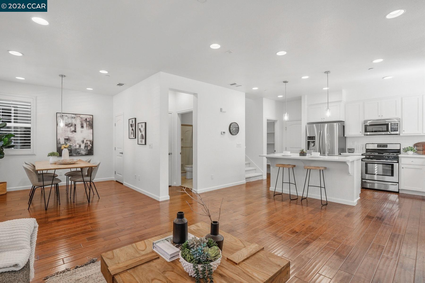 22640 Filbert Street Hayward, CA 94541 - Photo 11 of 60 a living room with furniture wooden floor and kitchen view