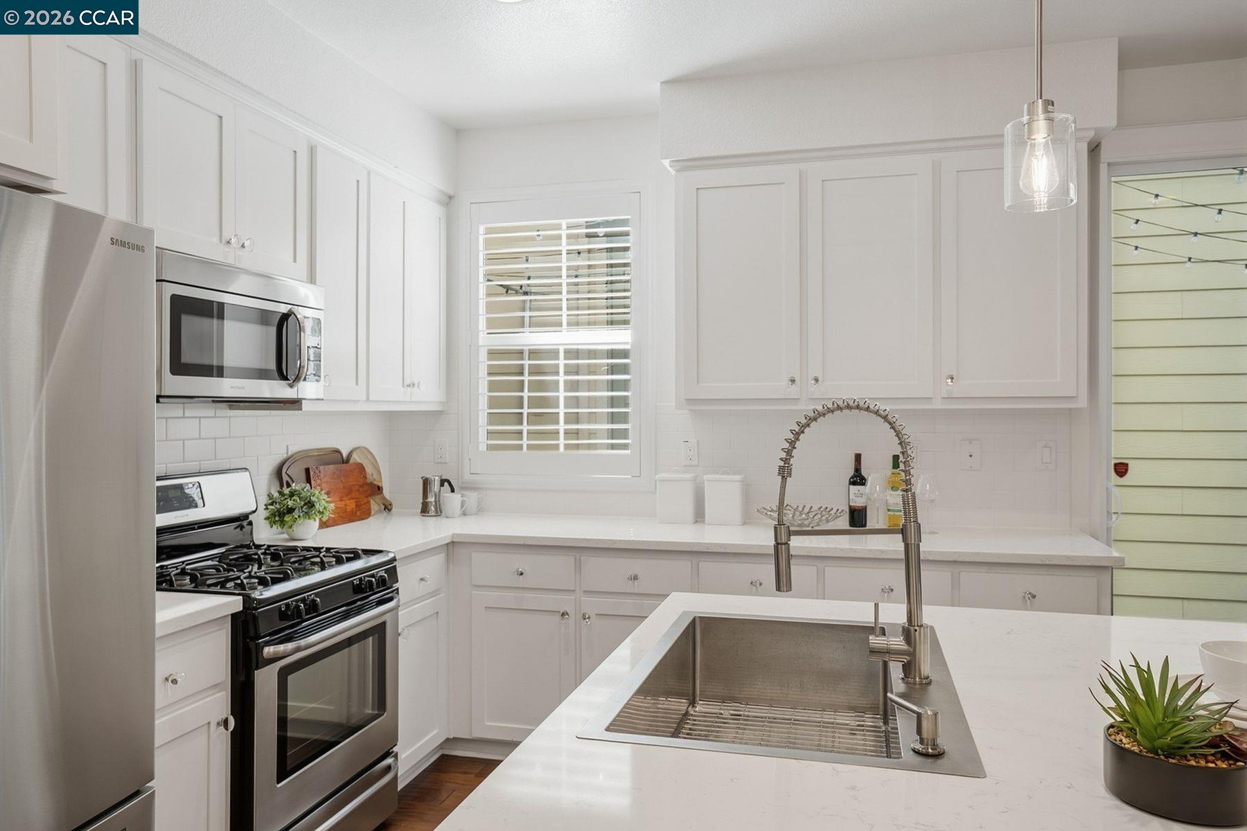 22640 Filbert Street Hayward, CA 94541 - Photo 19 of 60 a kitchen with granite countertop a sink stainless steel appliances and cabinets