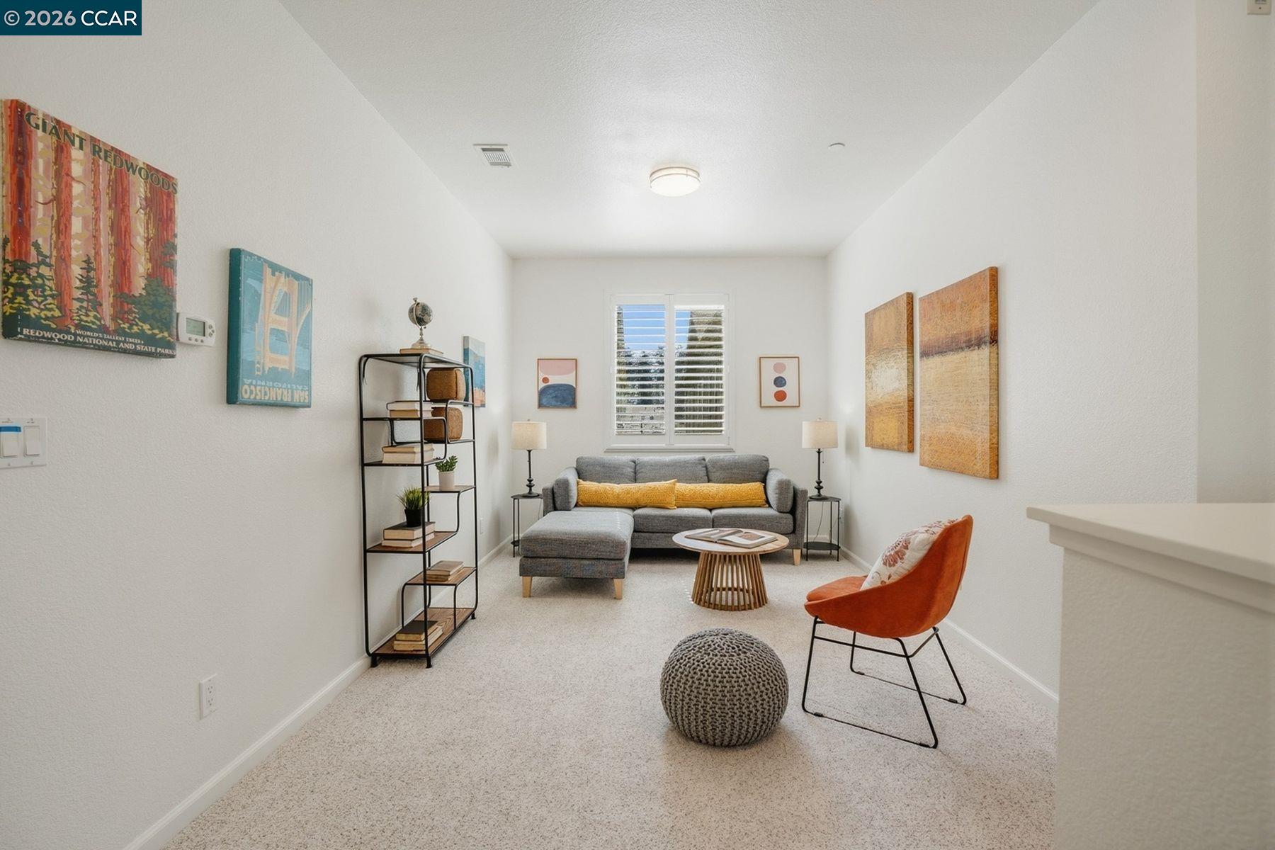22640 Filbert Street Hayward, CA 94541 - Photo 27 of 60 a bedroom with furniture and a book shelf