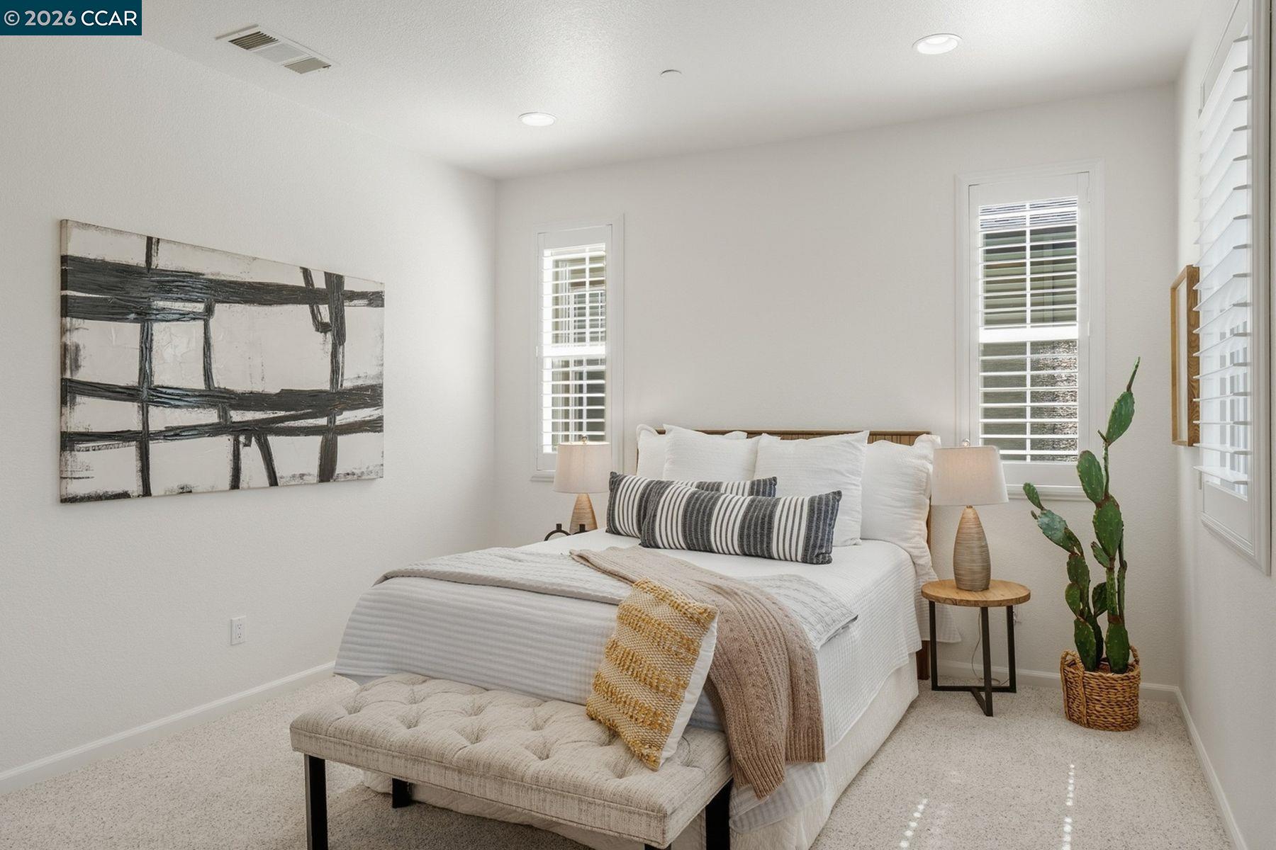 22640 Filbert Street Hayward, CA 94541 - Photo 34 of 60 a bedroom with a bed a mirror and a window