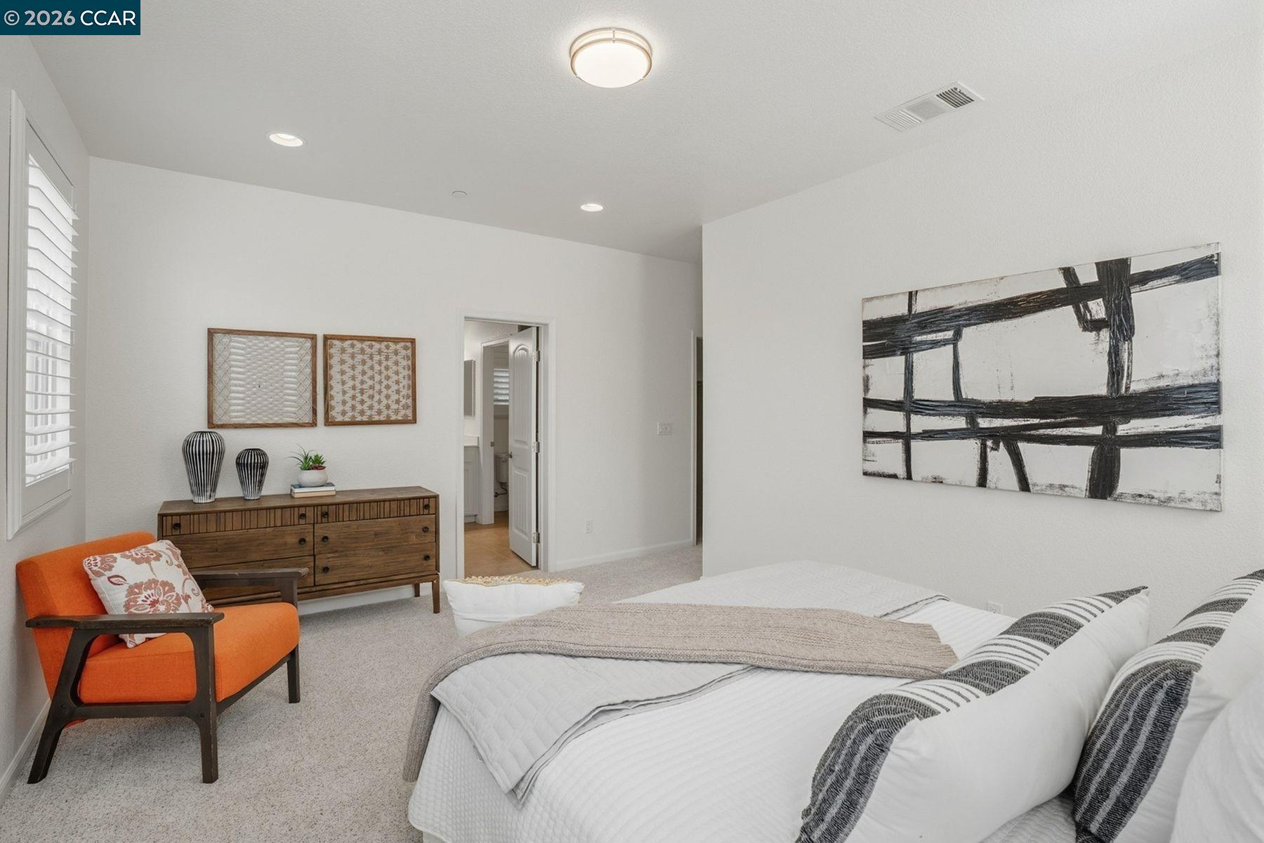 22640 Filbert Street Hayward, CA 94541 - Photo 36 of 60 a bedroom with a bed a chair and potted plant on the dresser