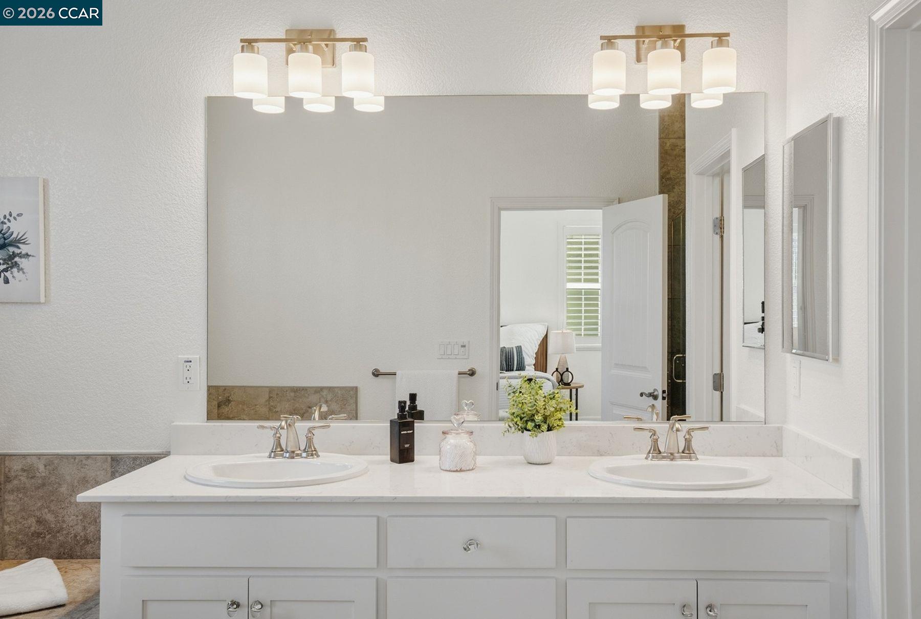 22640 Filbert Street Hayward, CA 94541 - Photo 40 of 60 a bathroom with a sink and a mirror
