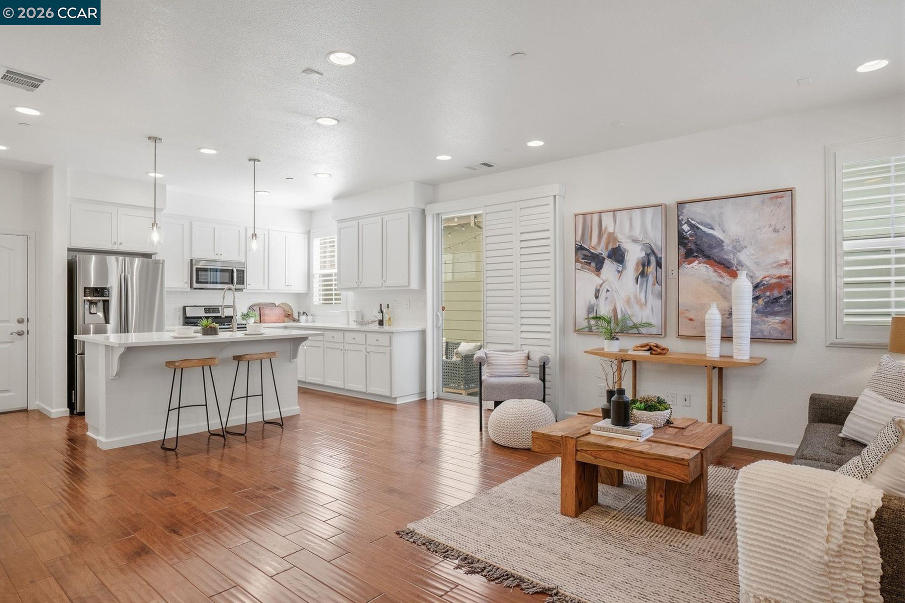 22640 Filbert Street Hayward, CA 94541 - Photo 4 of 60 a living room with stainless steel appliances kitchen island granite countertop furniture and a kitchen view