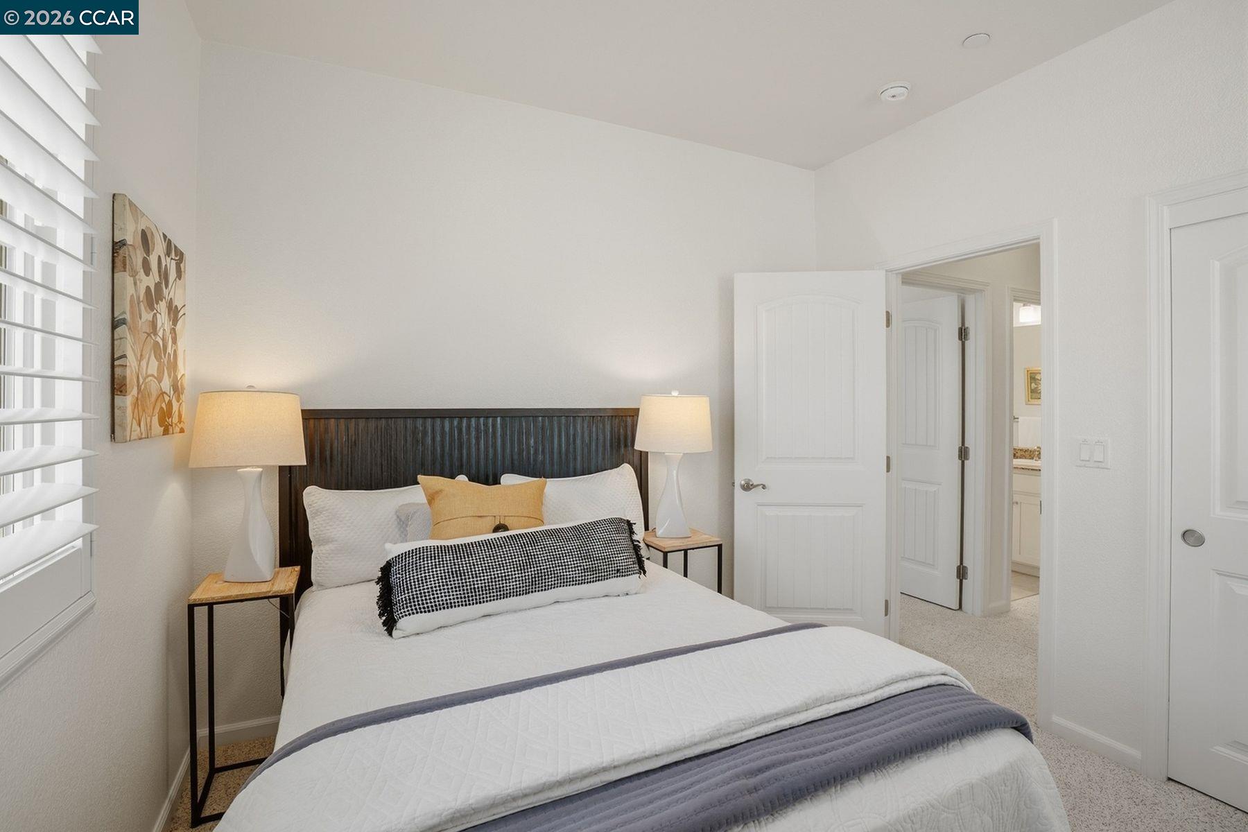 22640 Filbert Street Hayward, CA 94541 - Photo 49 of 60 a bedroom with a bed and a night stand