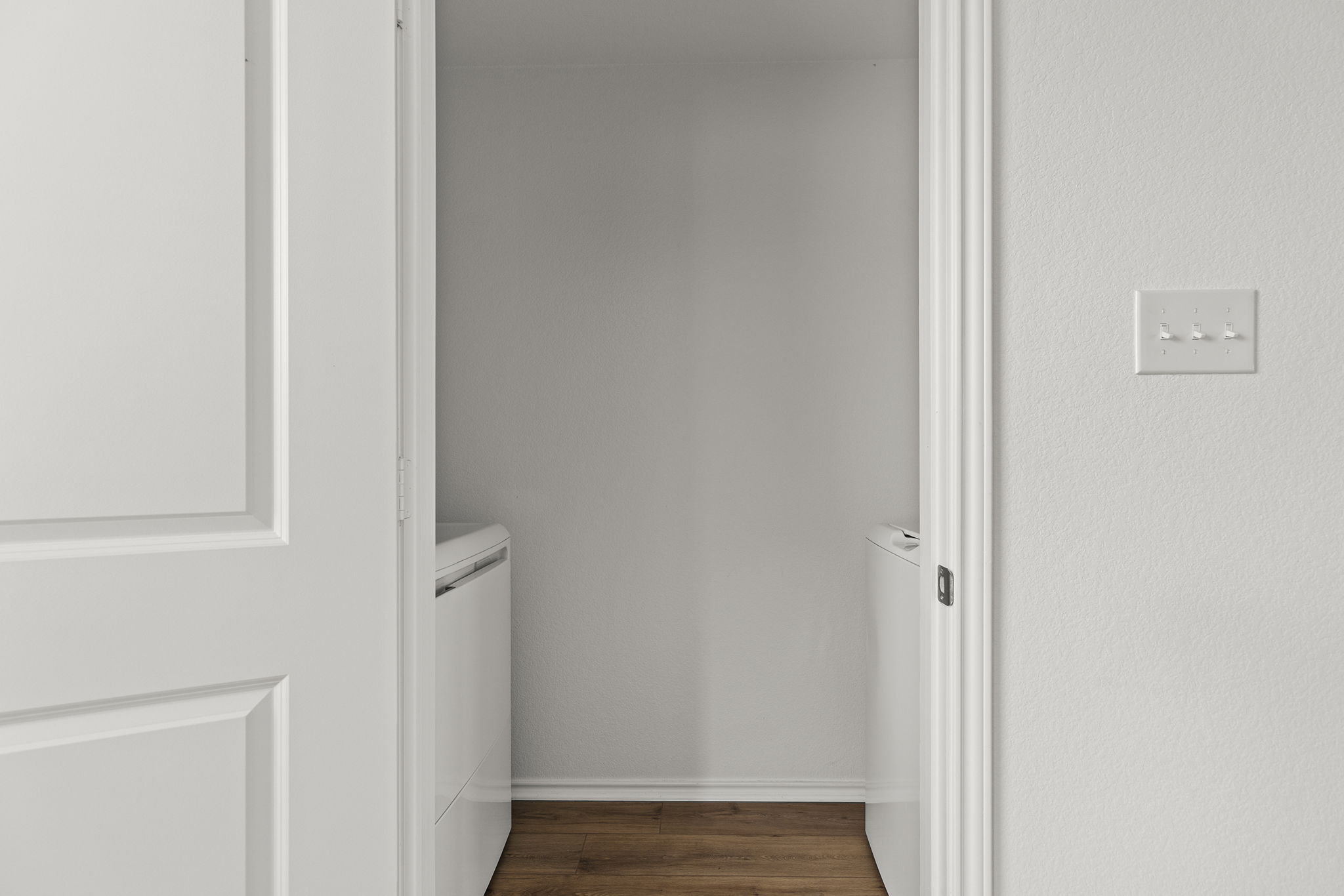 141 Texas Angel Way Jarrell, TX 76537 - Photo 17 of 33 a view of a hallway with wooden floor