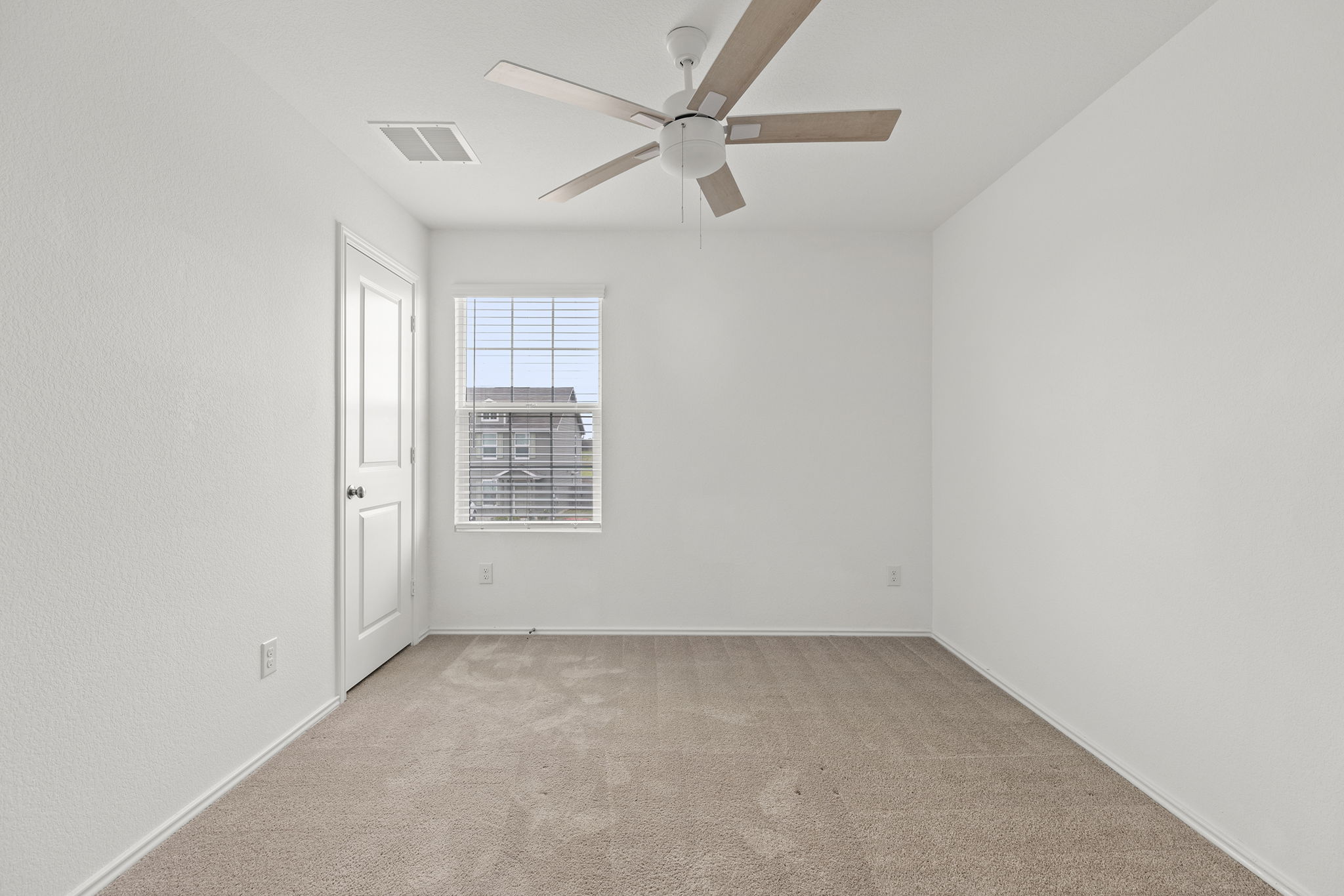 141 Texas Angel Way Jarrell, TX 76537 - Photo 24 of 33 an empty room with a window and a fan