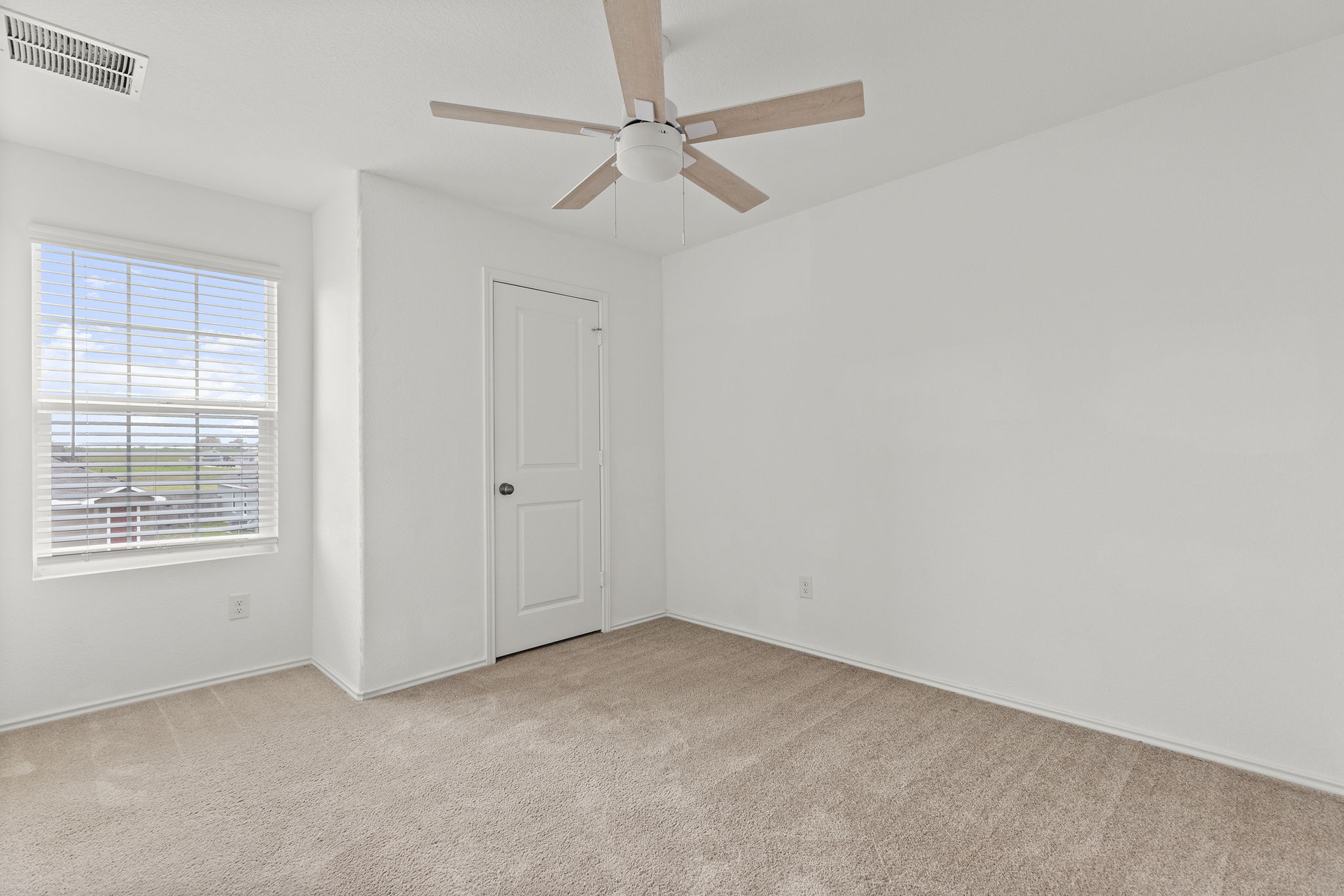 141 Texas Angel Way Jarrell, TX 76537 - Photo 27 of 33 an empty room with a window and a fan