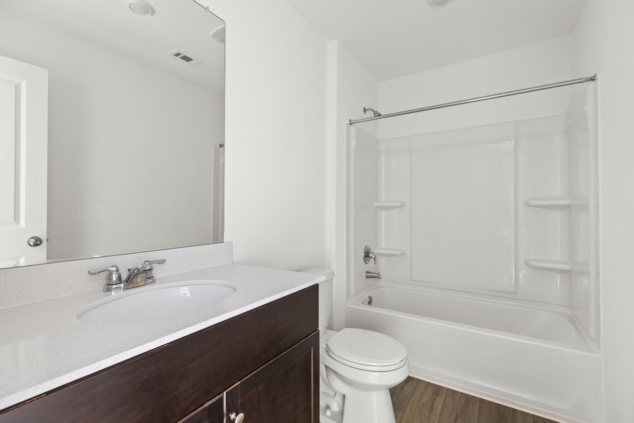 141 Texas Angel Way Jarrell, TX 76537 - Photo 28 of 33 a bathroom with a sink mirror toilet and bathtub