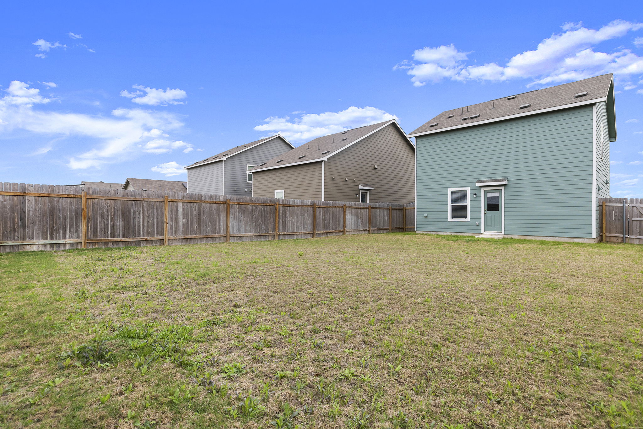 141 Texas Angel Way Jarrell, TX 76537 - Photo 30 of 33 a view of a house with a backyard