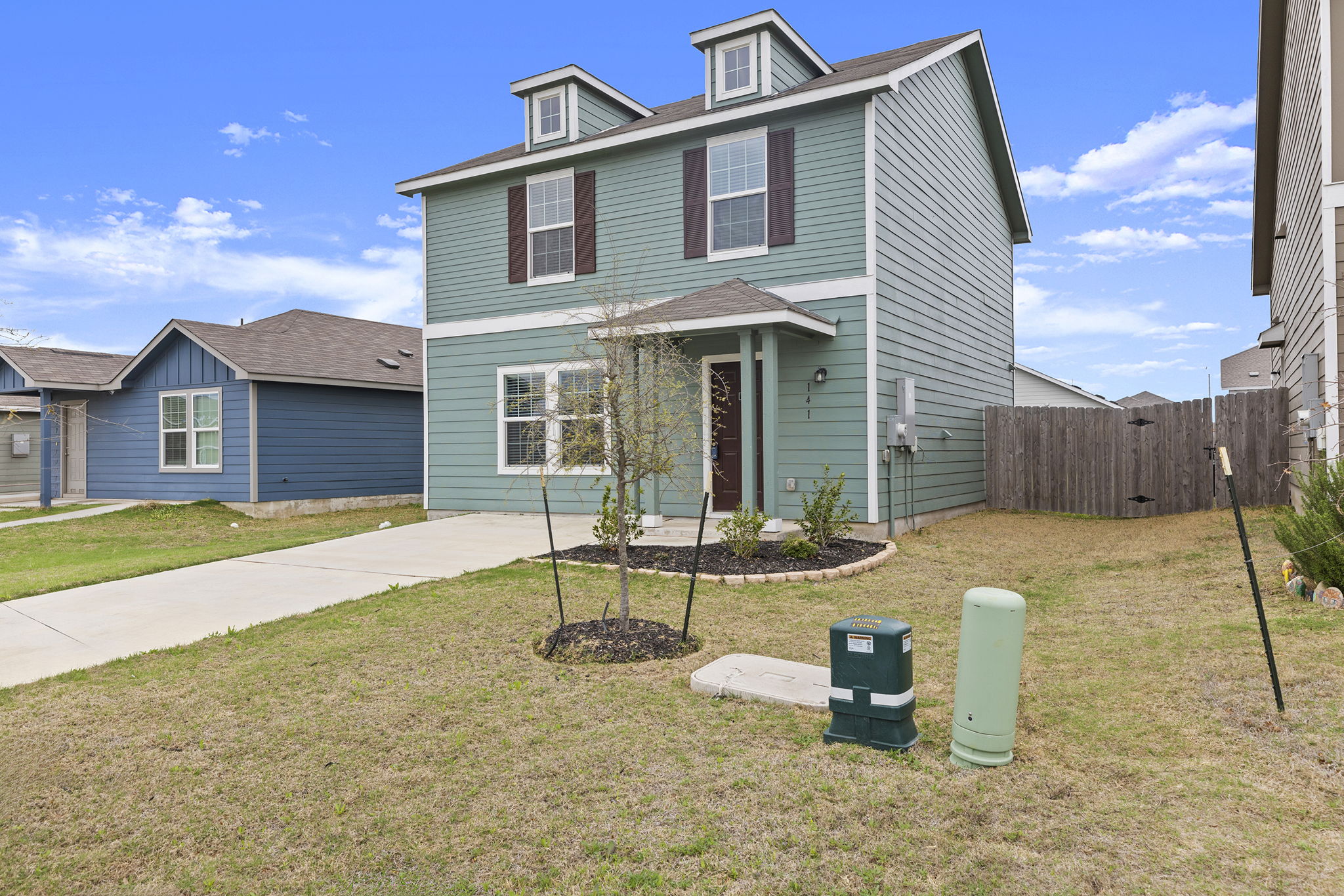141 Texas Angel Way Jarrell, TX 76537 - Photo 3 of 33 a view of a house with backyard and sitting area