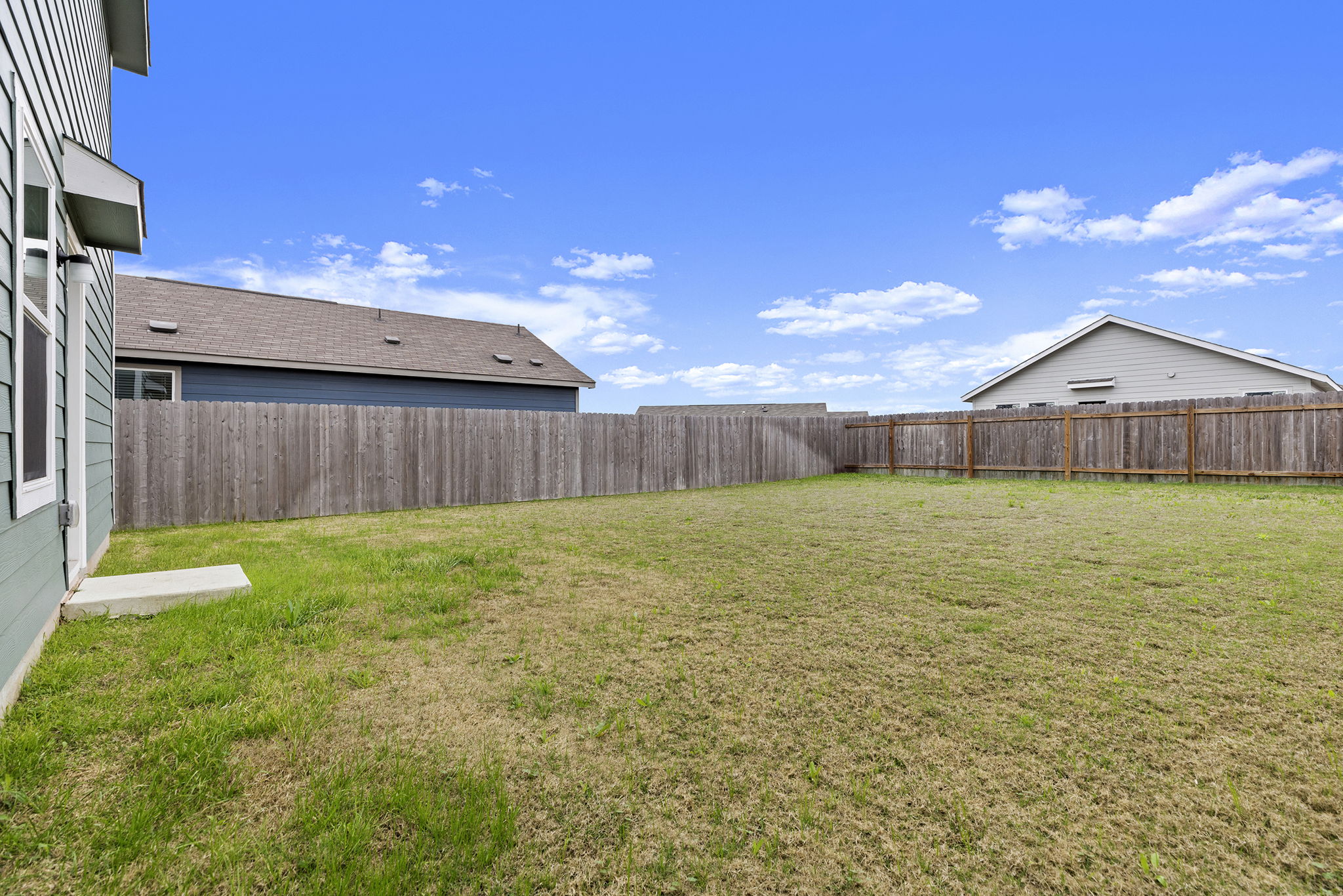 141 Texas Angel Way Jarrell, TX 76537 - Photo 32 of 33 a view of a house with a backyard