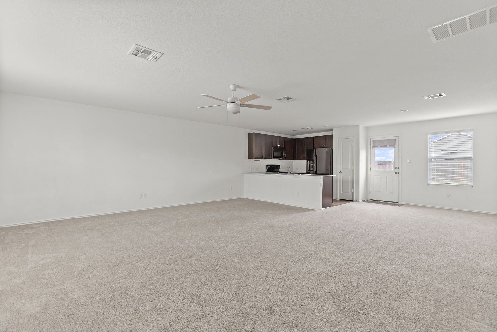 141 Texas Angel Way Jarrell, TX 76537 - Photo 5 of 33 a view of a livingroom with a kitchen