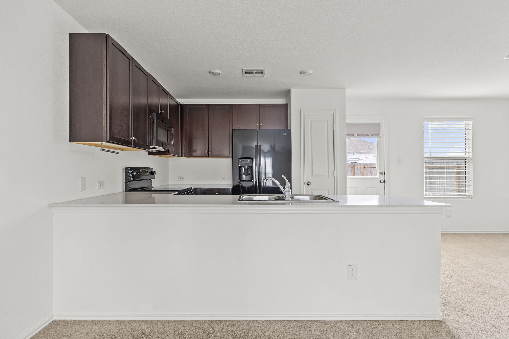141 Texas Angel Way Jarrell, TX 76537 - Photo 8 of 33 a view of a kitchen with a sink