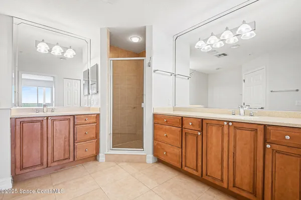 a bathroom with a bathtub shower and sink