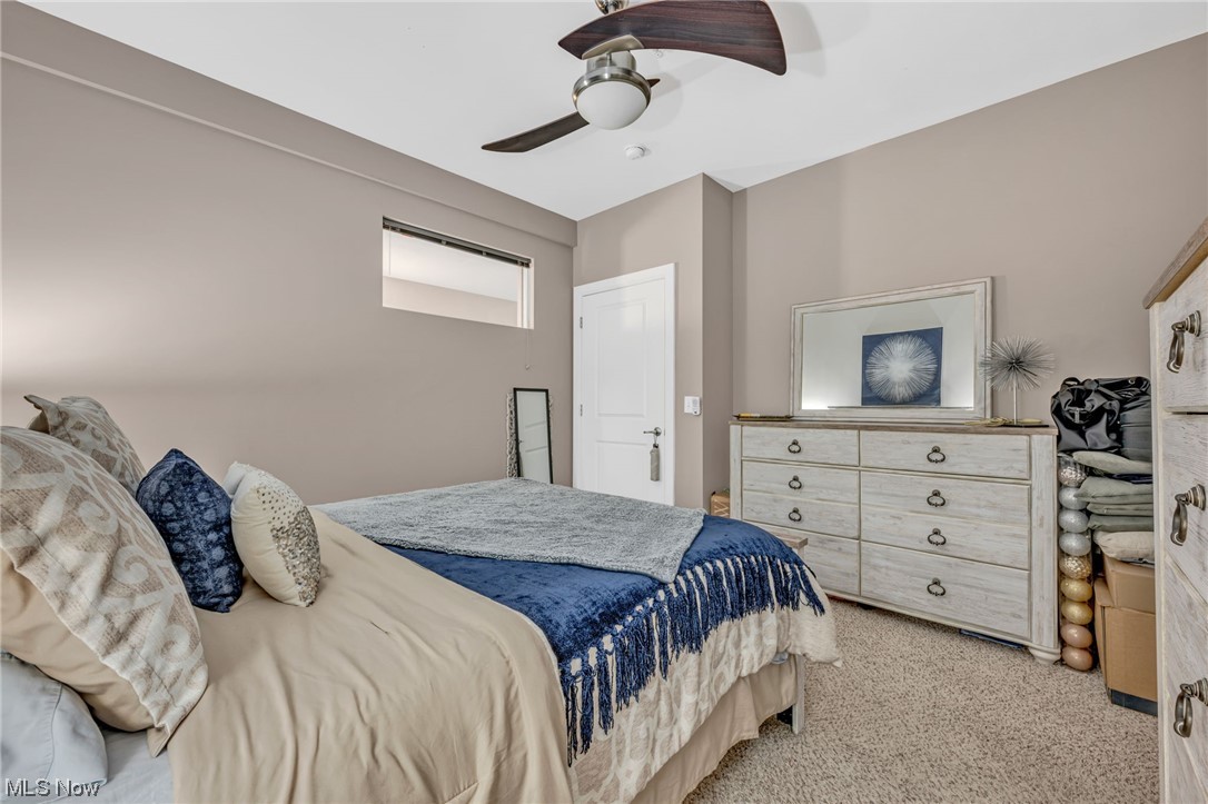 1237 Washington Avenue, Unit 1110 Cleveland, OH 44113 - Photo 19 of 28 Bedroom with light carpet and ceiling fan